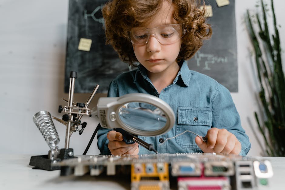 build standout junior qa engineer - Child using tools like magnifying glass and soldering iron to learn electronics.