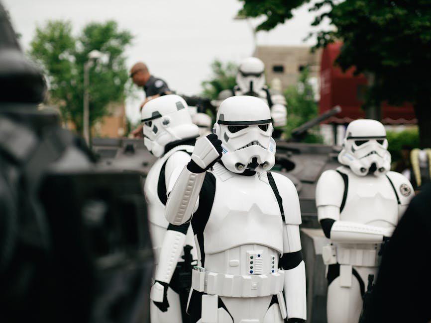 from sci fi salary rise - Group of Star Wars stormtrooper cosplayers gathering outdoors during the day.